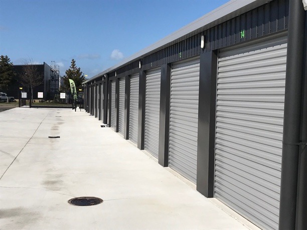 a line of self storage units with the shutters down